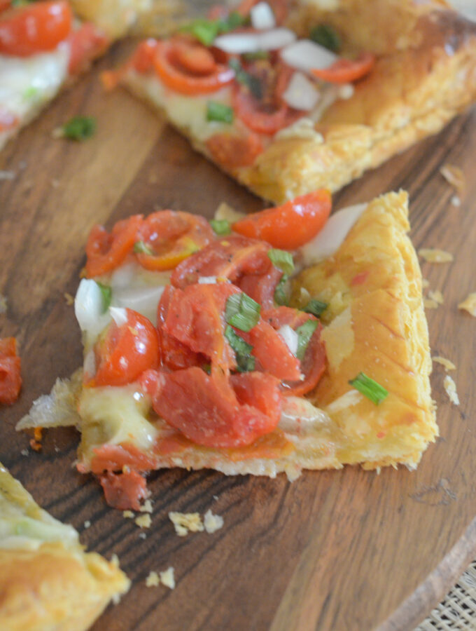 tomato tart with puff pastry sliced on napkins