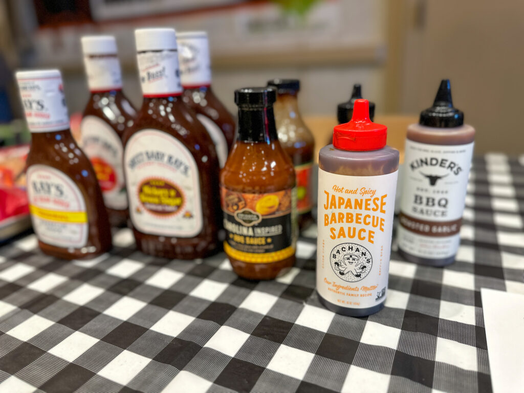 line up of bbq sauces on table