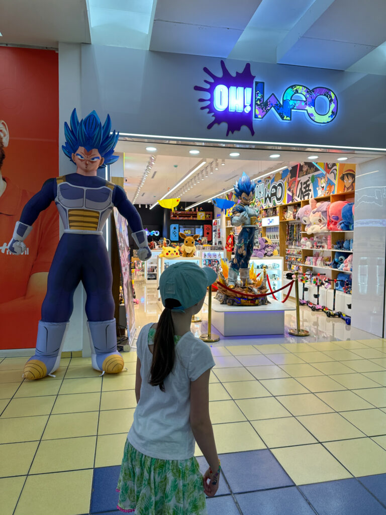 little girl going into OH WAO store in Albrook Mall in Central America