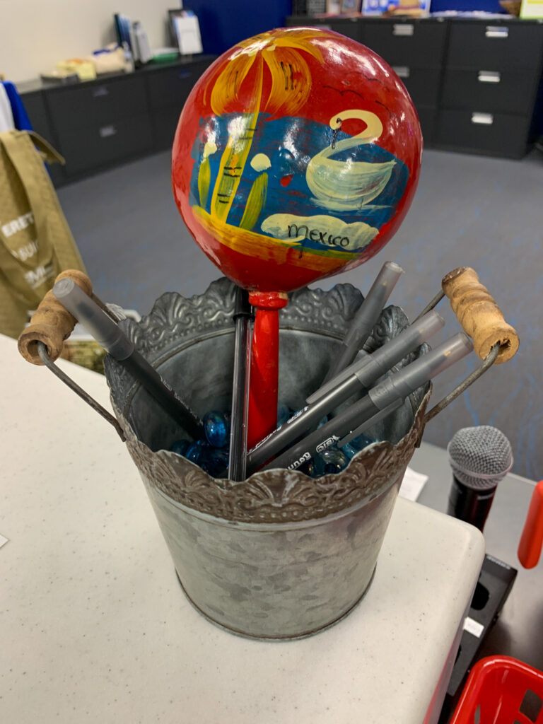 can of pens with a Mexico maraca tucked in for school Hispanic Heritage Month decorations