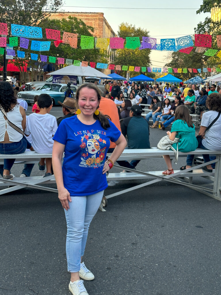 woman wears Hispanic Heritage Month t-shirt at Hispanic Heritage Month event in El Dorado, Arkansas