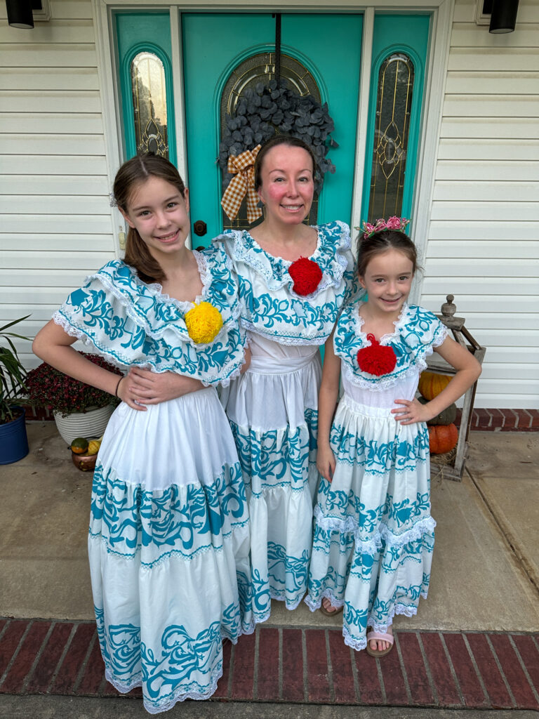 women and daughters wearing Panamanian pollera dresses