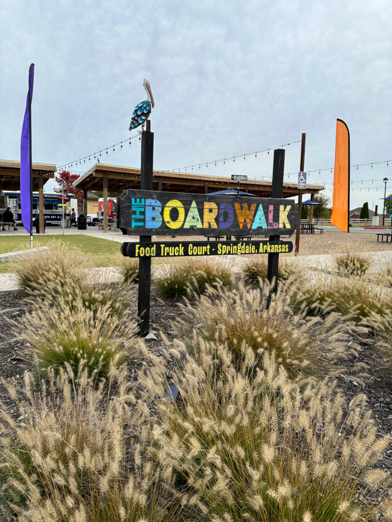 sign at the Boardwalk food truck court in Springdale 