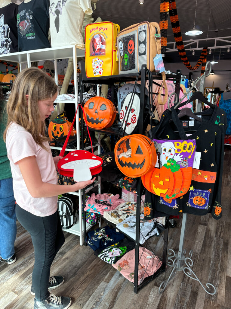 girl shopping in Dela DeVille's Vintage Shop in northwest Arkansas