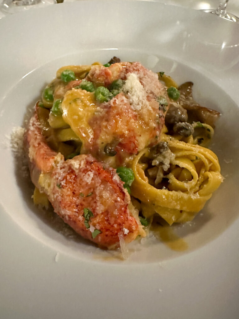 lobster pasta in white bowl