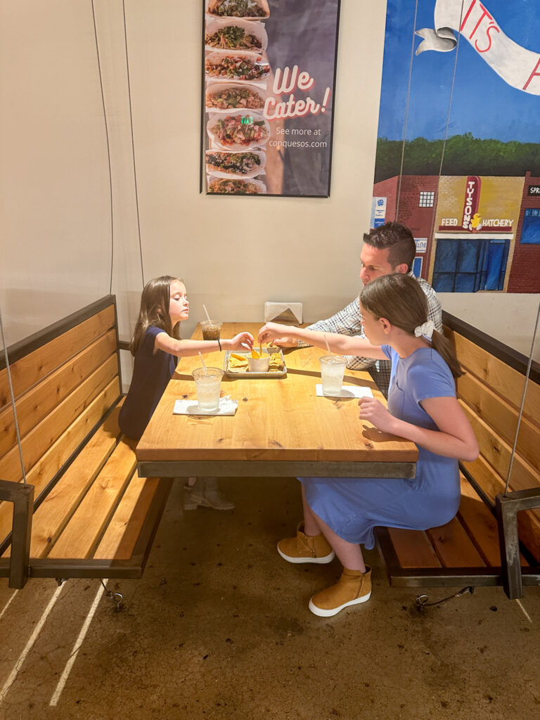 family eating cheese dip at Con Quesos in Springdale, Arkansas