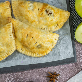 air fryer apple empanadas on tray in overhead view