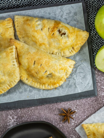 air fryer apple empanadas on tray in overhead view