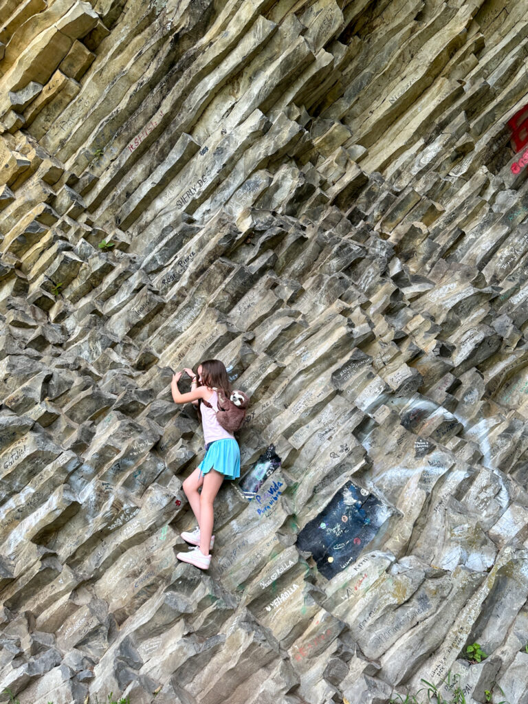 little girl climbing rocks at Los Ladrillos in Boquete, Panama