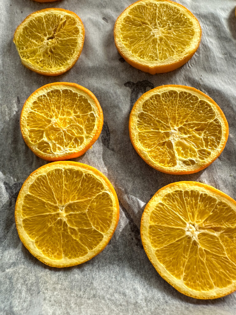 dried orange wheels on parchment