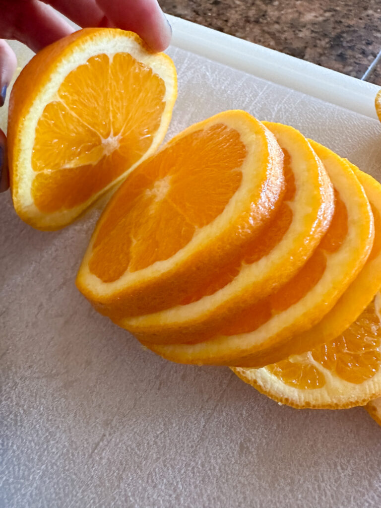 sliced fruit on plastic cutting board