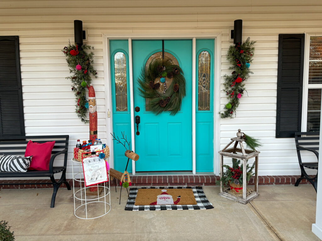 front porch set up with a station for snacks for delivery drivers with a printable sign hanging