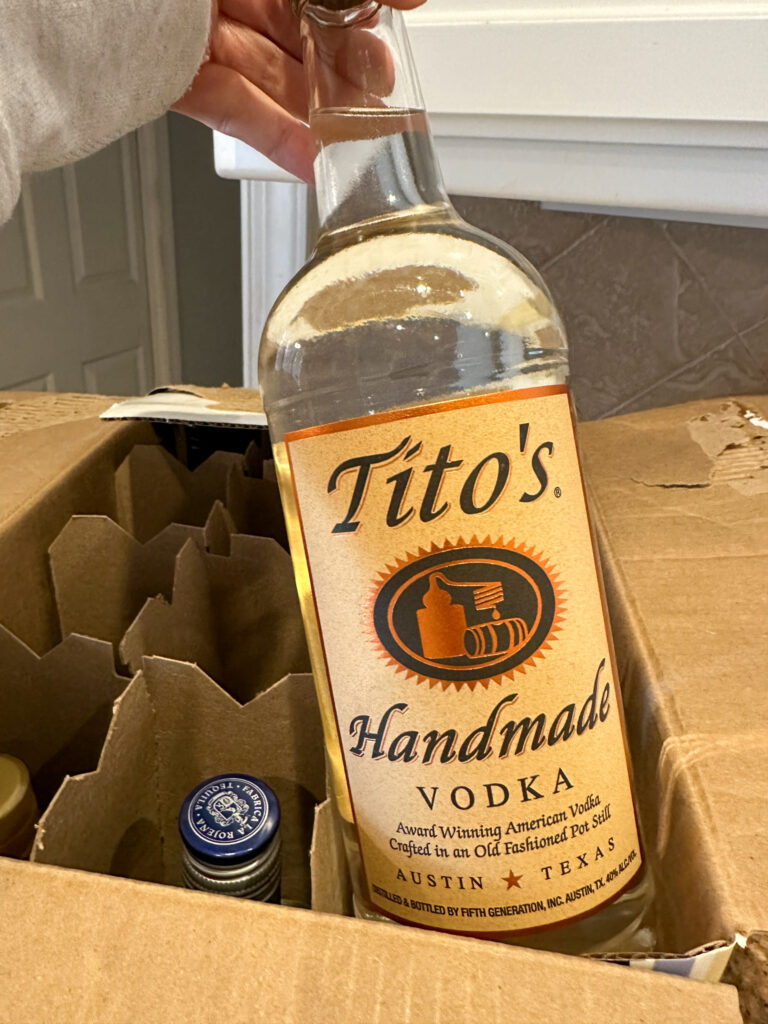 Tito's for home bar cart with printable cocktail of the month calendar