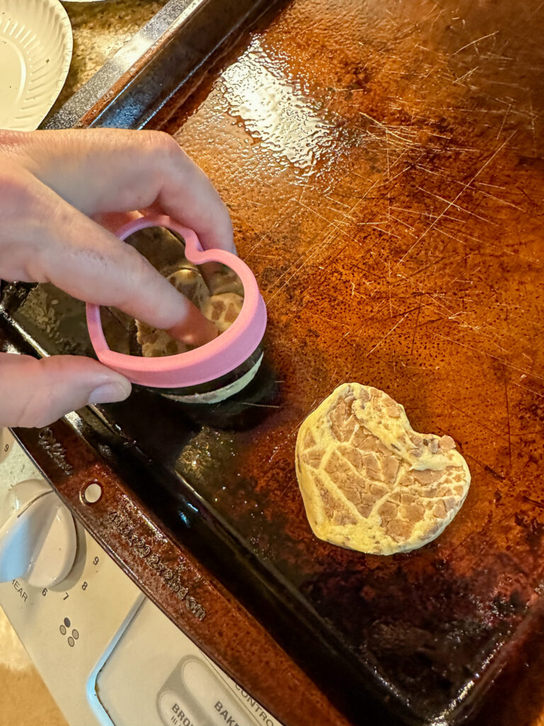 making heart-shaped cinnamon rolls