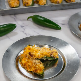 air fryer cream cheese poppers on silver plate