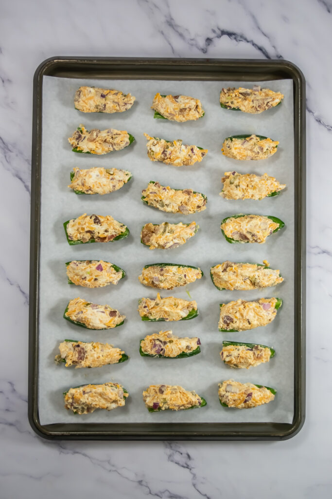 tray of jalapeno poppers for the air fryer on tray ready to cook