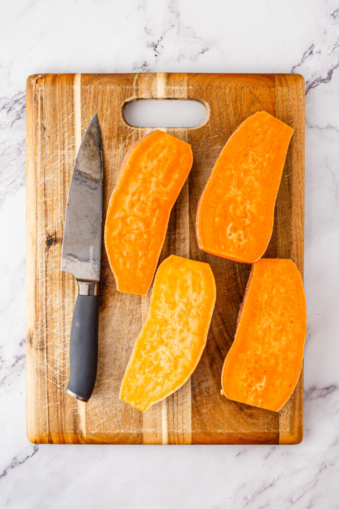 vegetables cut open on cutting board with knife