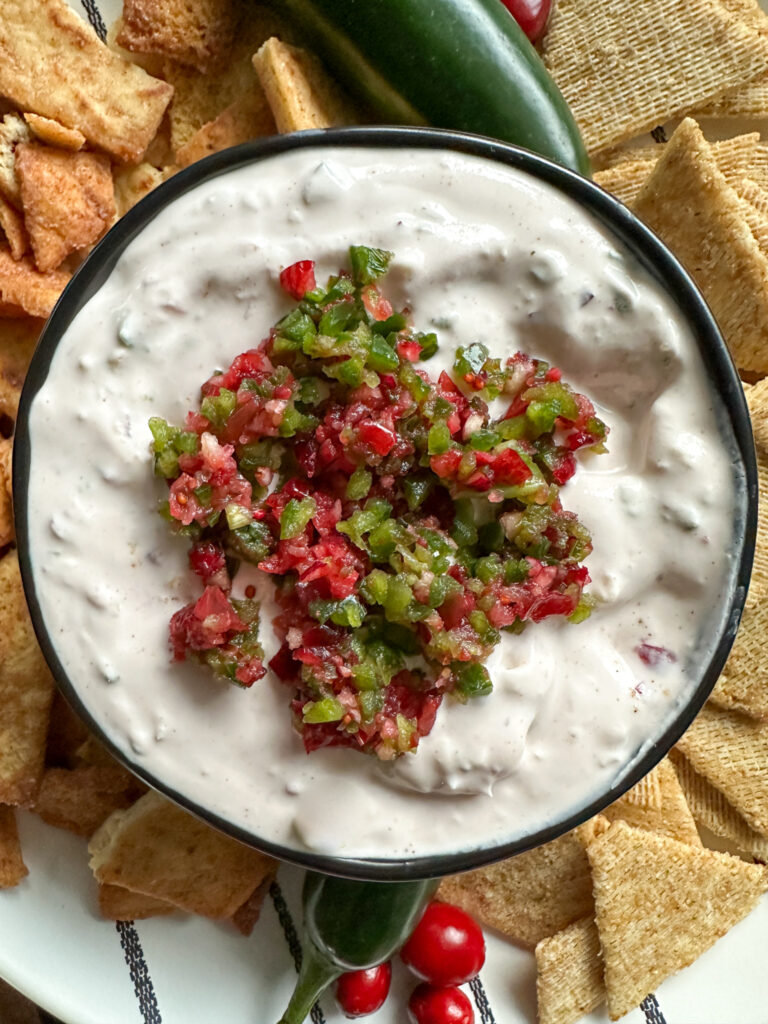 cranberry jalapeño dip in black bowl