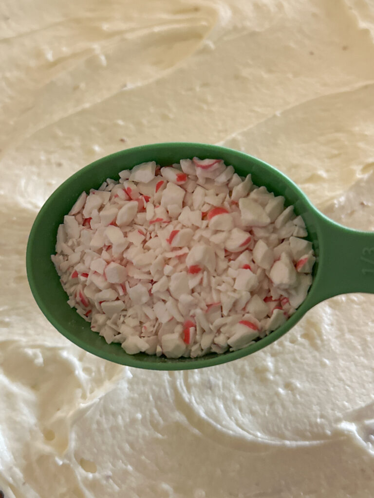 crushed peppermint over bowl of peppermint dip