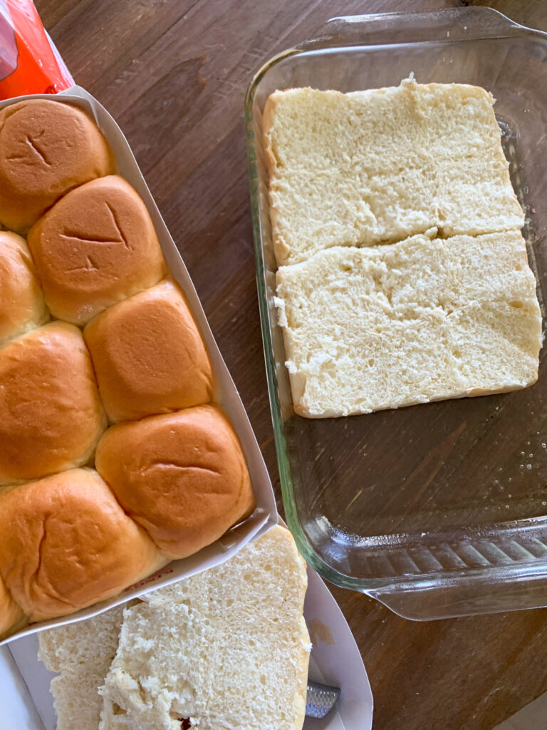 bottom half of bread going into glass pan