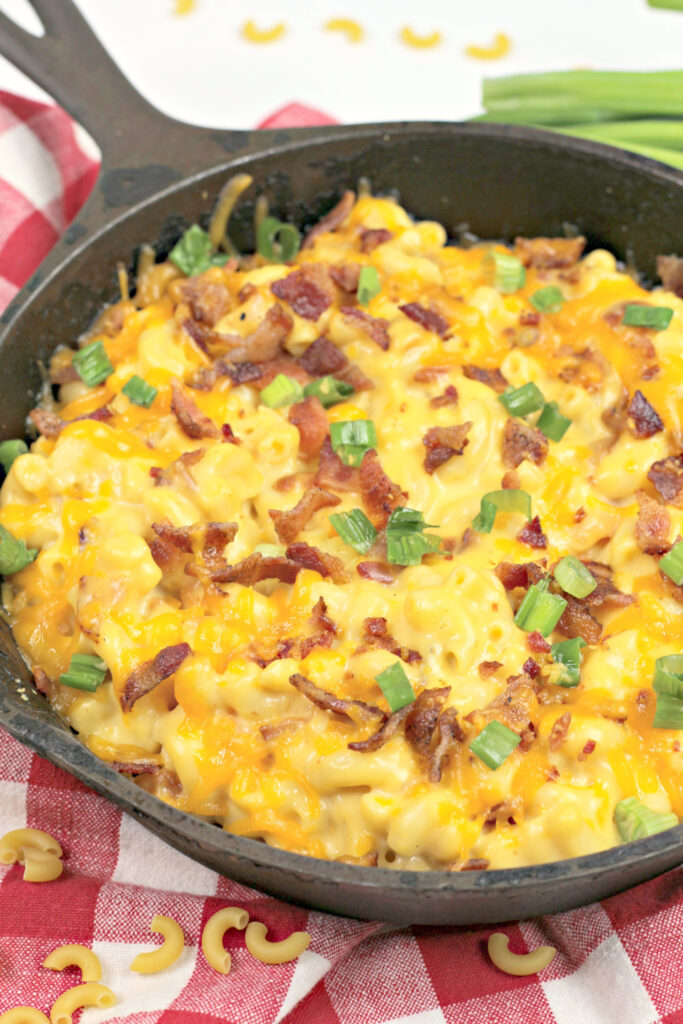 bacon ranch mac and cheese in skillet on red plaid napkin