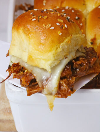 chopped beef brisket sliders with apricot barbecue sauce on spatula