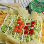 football field party dip with wooden utensils at back