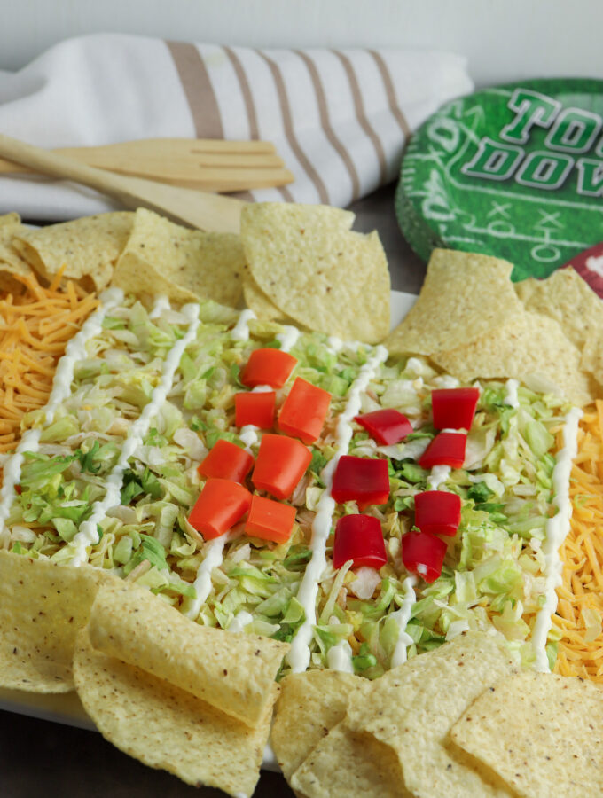 football field party dip with wooden utensils at back