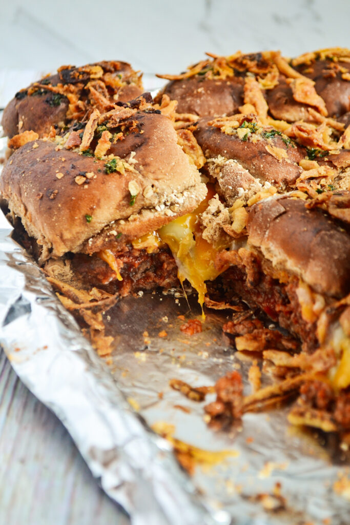 Manwich sloppy Joe sliders on foil-rimmed tray with a few missing