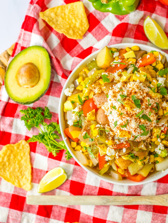 slow cooker Mexican street corn soup on red and white napkin