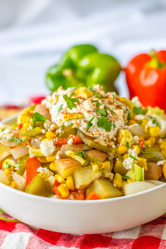 slow cooker Mexican street corn soup in white bowl 