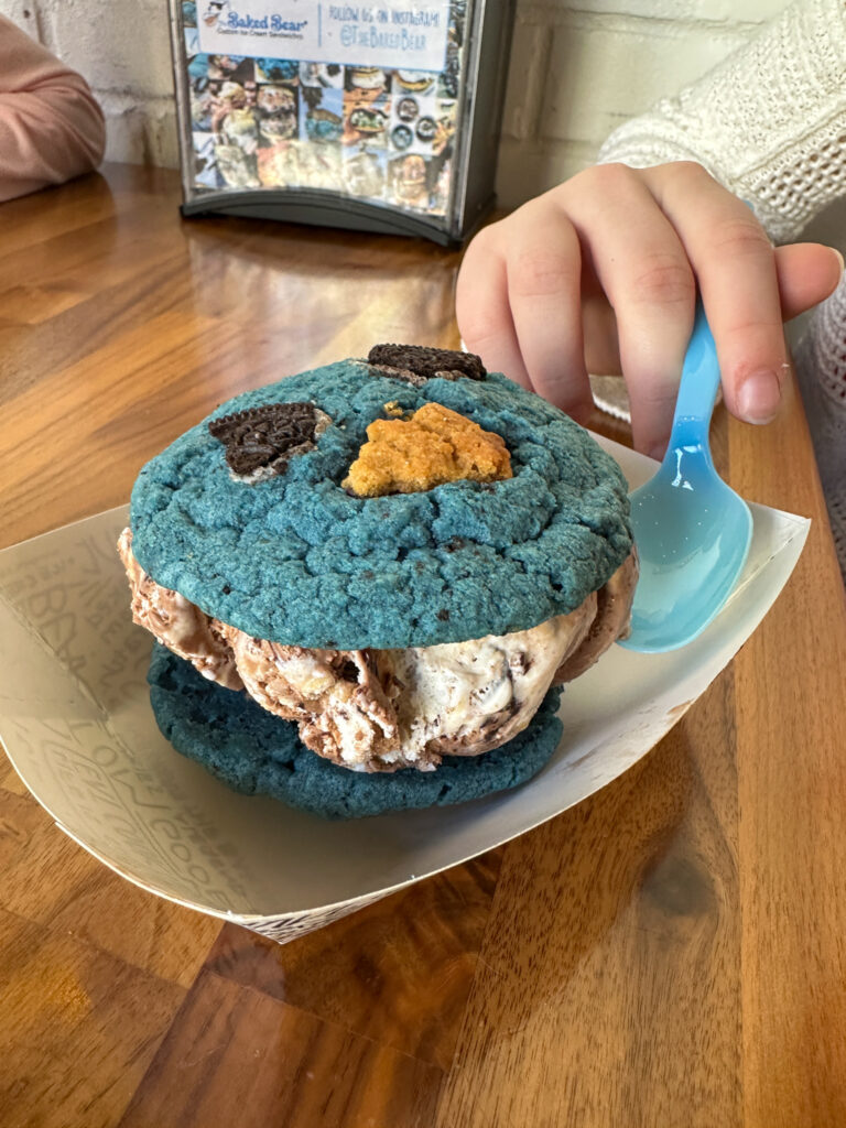 spoon near a monster cookie ice cream sandwich at The Baked Bear in downtown Nashville