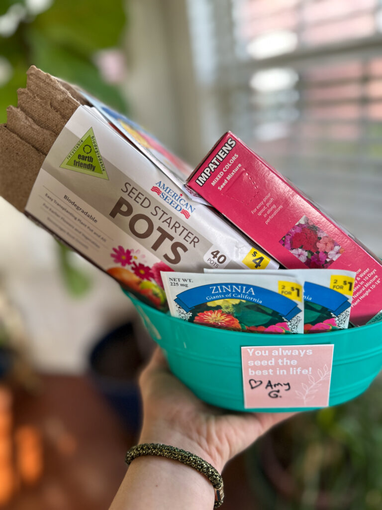 woman holding plant gift basket with free printable plant gift tags that say "You Always Seed the Best in Life"