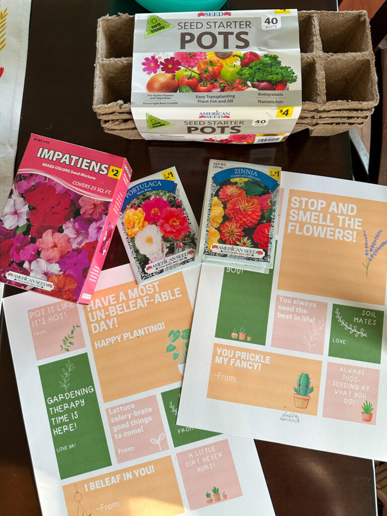 flower seeds and free printable plant gift tags beside seed starter trays
