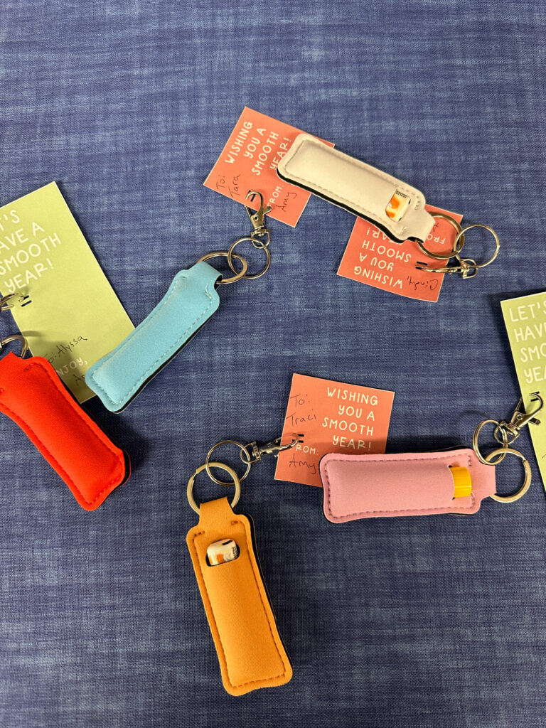 lip balm gifts with Chapstick pouches and free lip balm gift tags on blue background