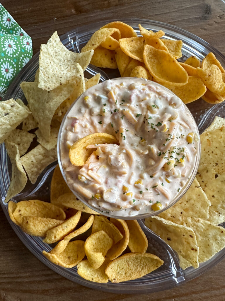 chilled Mexicorn dip with Rotel in glass bowl with chips