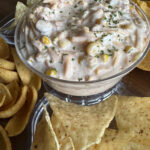 chilled Mexicorn Dip with Rotel on plate with chips