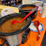 chili cook off at work slow cookers in a line