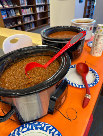 chili cook off at work slow cookers in a line