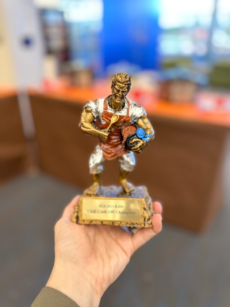 Beast of Chili cook off trophy in woman's hand