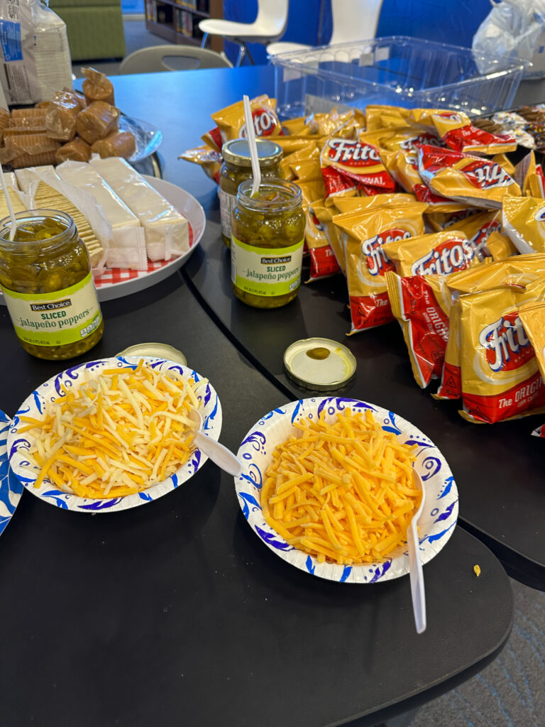 cheese and bags of Fritos on table