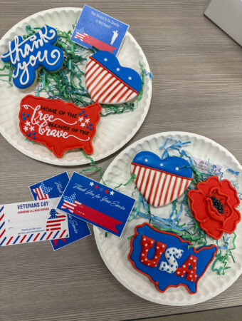 Veteran's Day cookies on plates with gift tags beside