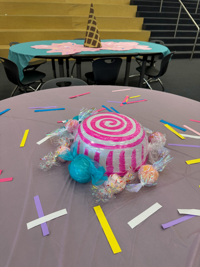 candy decorations on table at a sweets and treats goodbye party