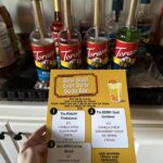 woman holds free dirty soda bar for staff appreciation