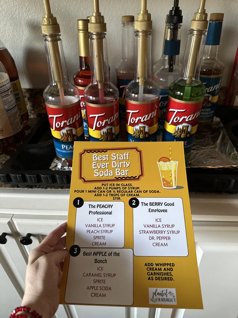 free staff appreciation dirty soda bar menu in front of Torani syrups on a tray